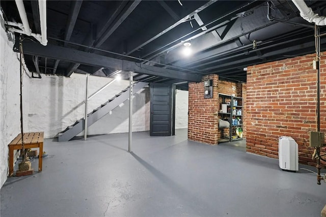 3855 Hiawatha St, Brighton Heights, PA 15212 - unfinished basement featuring stairway and brick wall