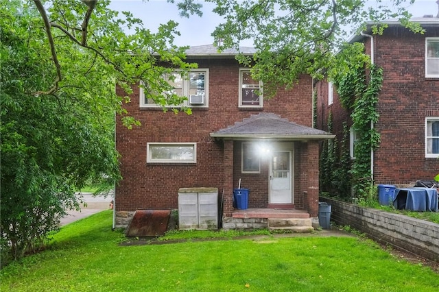 3855 Hiawatha St, Brighton Heights, PA 15212 - rear view of house with a yard and brick siding
