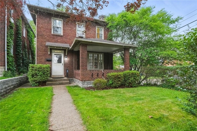 3855 Hiawatha St, Brighton Heights, PA 15212 - view of front of home with brick siding and a front yard