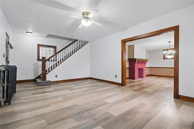 3855 Hiawatha St, Brighton Heights, PA 15212 - unfurnished living room featuring wood finished floors, stairway, baseboards, and a ceiling fan