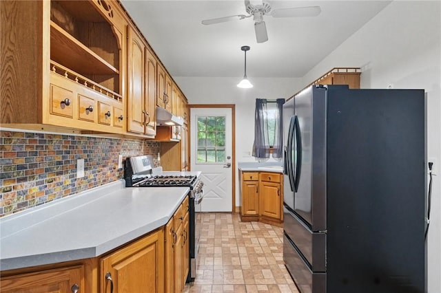 3855 Hiawatha St, Brighton Heights, PA 15212 - kitchen featuring stainless steel appliances, decorative backsplash, a ceiling fan, under cabinet range hood, and brown cabinets