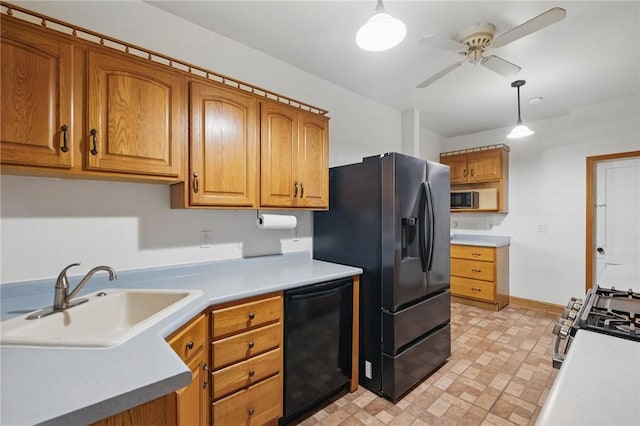 3855 Hiawatha St, Brighton Heights, PA 15212 - kitchen featuring black dishwasher, a sink, fridge with ice dispenser, ceiling fan, and stainless steel gas range oven