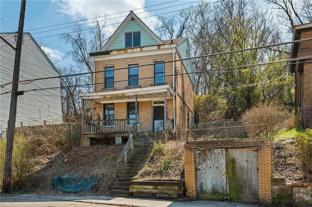 1339 Romanhoff St, Spring Hill, PA 15212 - american foursquare style home with brick siding, a porch, and stairs