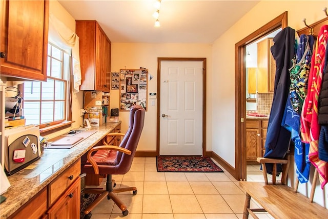 101 Timber Ct, Franklin Twp But, PA 16052 - office area featuring light tile patterned floors, baseboards, built in desk, and track lighting