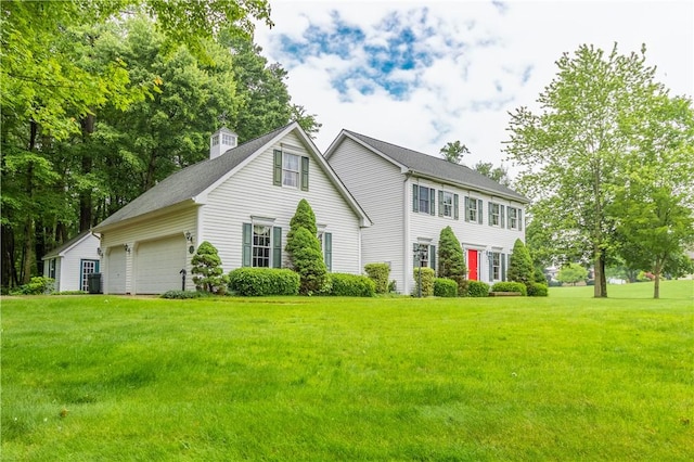 101 Timber Ct, Franklin Twp But, PA 16052 - colonial inspired home with a garage, a front yard, and a chimney