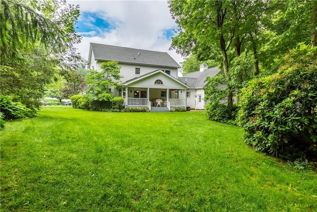 101 Timber Ct, Franklin Twp But, PA 16052 - rear view of property with covered porch and a yard