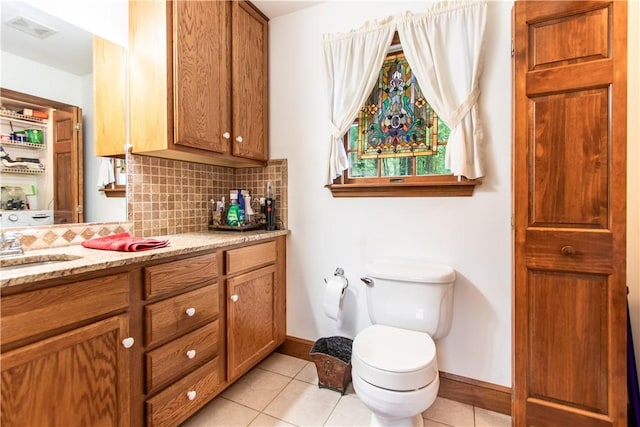 101 Timber Ct, Franklin Twp But, PA 16052 - bathroom featuring baseboards, vanity, decorative backsplash, and tile patterned floors