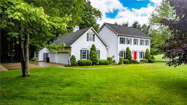 101 Timber Ct, Franklin Twp But, PA 16052 - colonial inspired home with a chimney, concrete driveway, a front lawn, a shingled roof, and an attached garage