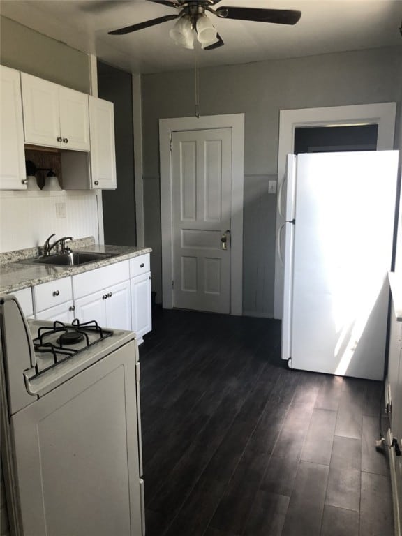 941-943 Cypress Way, Glassport, PA 15045 - kitchen with white appliances, a sink, ceiling fan, white cabinets, and dark wood-style floors