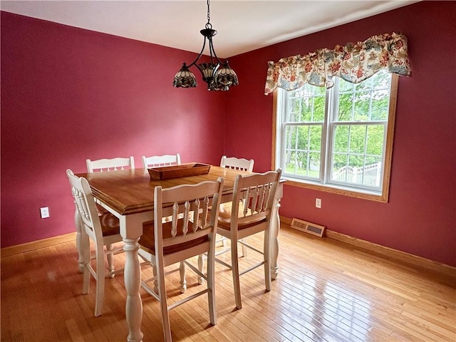 121 Cardinal Dr, East Franklin Twp, PA 16201 - dining room with light wood-style floors and baseboards