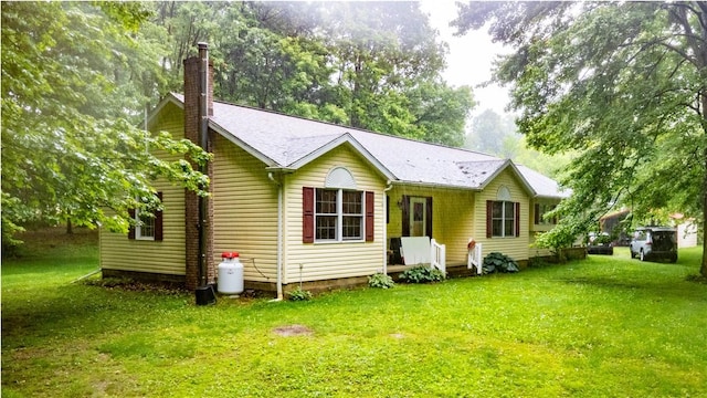 287 Hungarian Rd, Slippery Rock Twp But, PA 16057 - rear view of property featuring a chimney and a lawn
