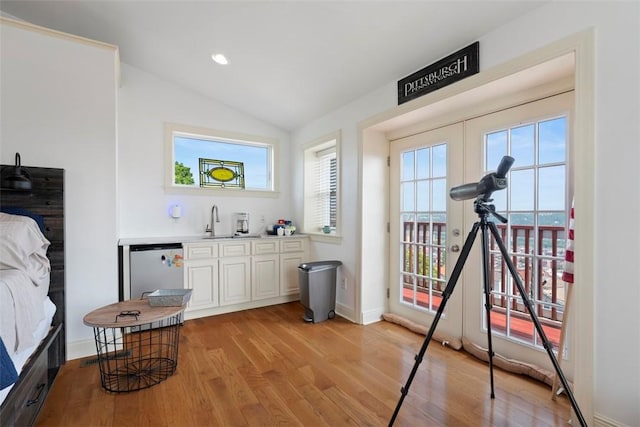 2700 Sumner St, South Side, PA 15203 - bar area with healthy amount of natural light, light wood-style floors, a sink, lofted ceiling, and baseboards