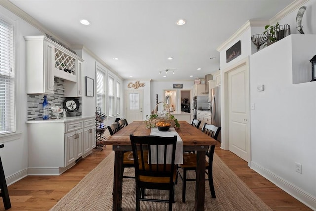 2700 Sumner St, South Side, PA 15203 - dining area with light wood finished floors, recessed lighting, baseboards, and crown molding