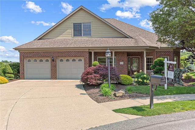 219 Fuji Dr, North Strabane, PA 15317 - view of front of home with brick siding, roof with shingles, driveway, and a garage