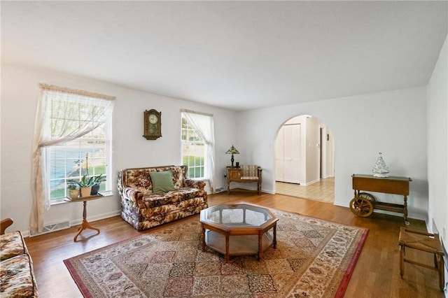 152 N Jamestown Rd, Moon/Crescent Twp, PA 15108 - living room with arched walkways and wood finished floors