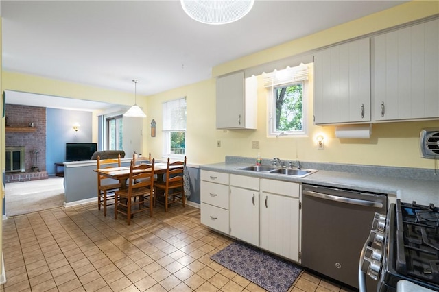 152 N Jamestown Rd, Moon/Crescent Twp, PA 15108 - kitchen featuring stainless steel dishwasher, range with gas stovetop, healthy amount of natural light, and light tile patterned floors