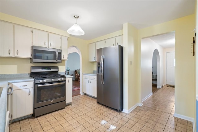 152 N Jamestown Rd, Moon/Crescent Twp, PA 15108 - kitchen with appliances with stainless steel finishes, arched walkways, light countertops, and white cabinets