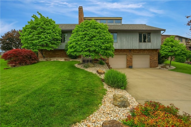 199 Rustic Dr, North Huntingdon, PA 15642 - view of front facade featuring concrete driveway, an attached garage, a front lawn, brick siding, and a shingled roof