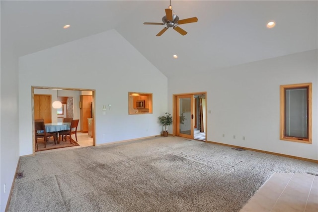 199 Rustic Dr, North Huntingdon, PA 15642 - unfurnished living room with high vaulted ceiling, light carpet, a ceiling fan, baseboards, and recessed lighting