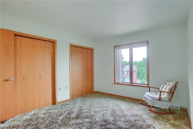 199 Rustic Dr, North Huntingdon, PA 15642 - unfurnished bedroom with multiple closets, carpet flooring, and baseboards