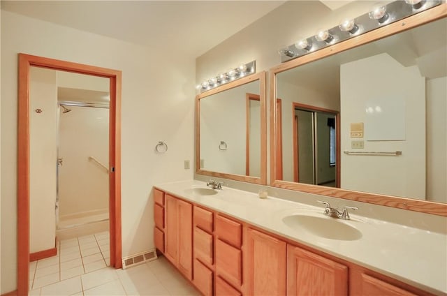 199 Rustic Dr, North Huntingdon, PA 15642 - bathroom with double vanity, tile patterned flooring, and a shower with door