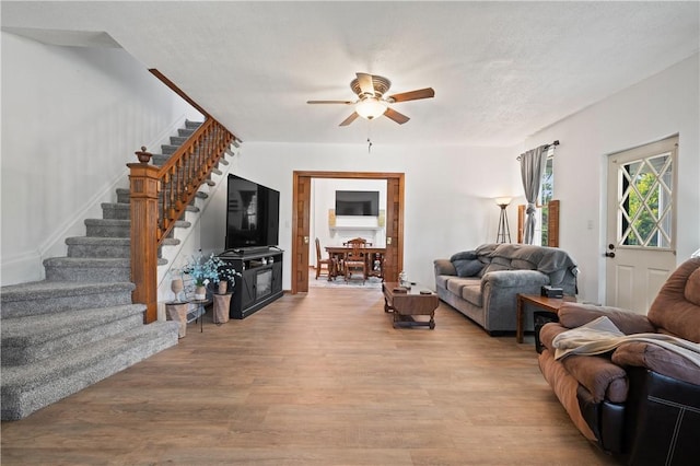 104 Overholt Dr, Scottdale, PA 15683 - living area featuring stairway, a ceiling fan, and wood finished floors