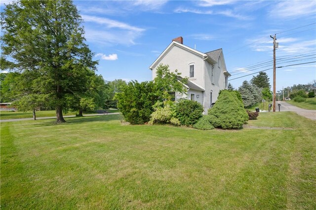 104 Overholt Dr, Scottdale, PA 15683 - view of side of home with a chimney and a yard