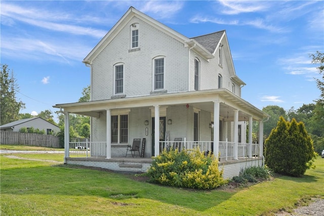104 Overholt Dr, Scottdale, PA 15683 - farmhouse inspired home featuring a porch and brick siding