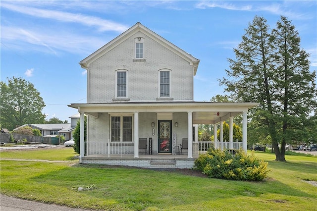 104 Overholt Dr, Scottdale, PA 15683 - view of front of home with a front lawn, brick siding, and covered porch