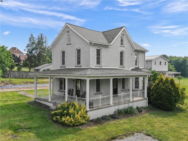104 Overholt Dr, Scottdale, PA 15683 - view of front of property with a porch, a front lawn, brick siding, and roof with shingles