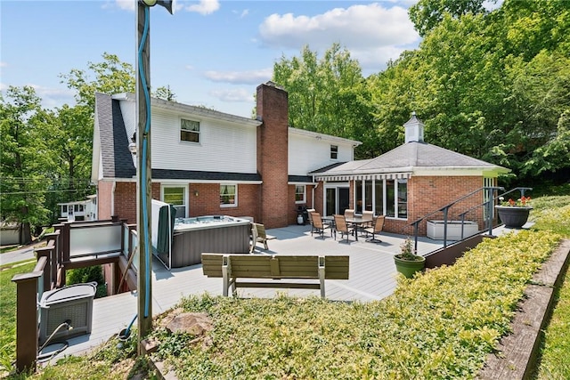 1199 Chestnut St, Indiana Boro Ind, PA 15701 - rear view of property with a hot tub, brick siding, a patio area, and a shingled roof
