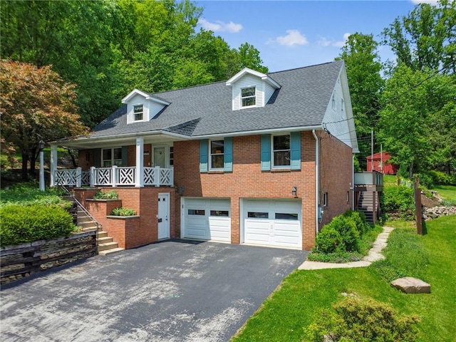 1199 Chestnut St, Indiana Boro Ind, PA 15701 - cape cod-style house with stairway, driveway, brick siding, a garage, and roof with shingles