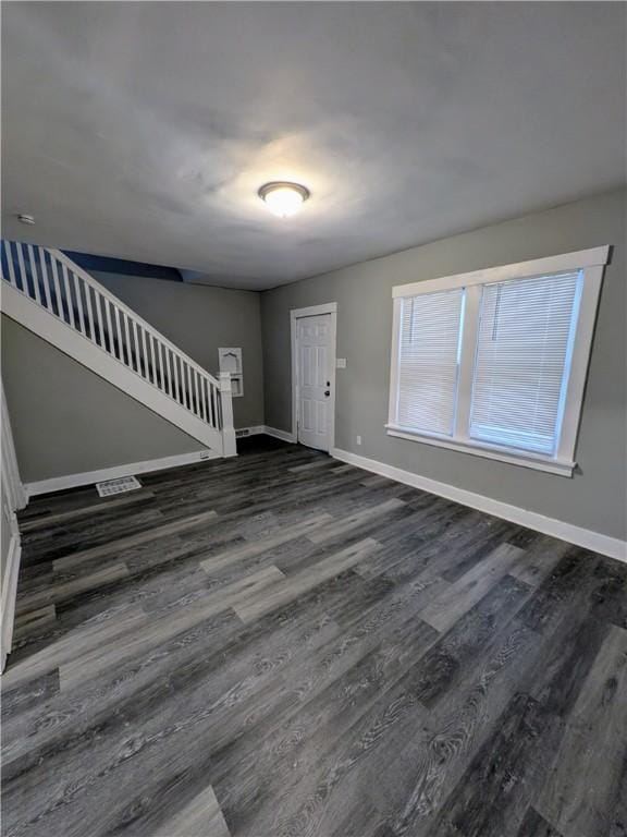 1217 Scott St, Mckeesport, PA 15132 - foyer entrance with stairway, baseboards, and dark wood-style flooring