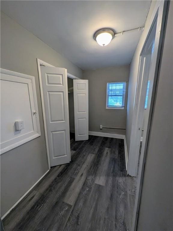 1217 Scott St, Mckeesport, PA 15132 - unfurnished bedroom featuring dark wood finished floors and baseboards