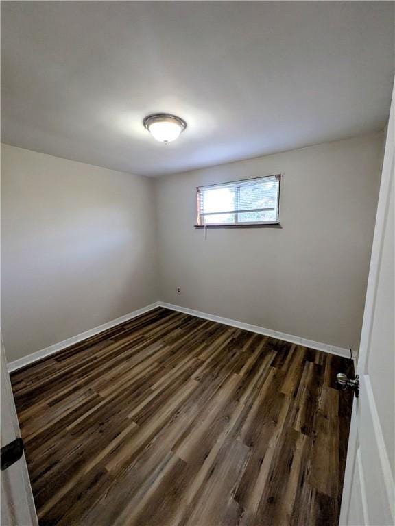 1105 Parkside Dr, Rear Brackenridge, PA 15014 - spare room with dark wood-style floors and baseboards