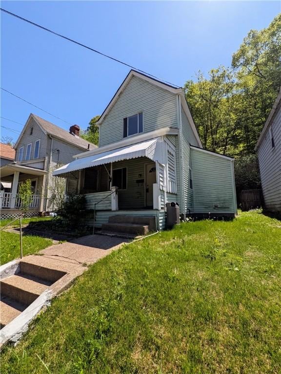 518 Glenn St, Wilmerding, PA 15148 - view of front of home featuring a front lawn and central AC