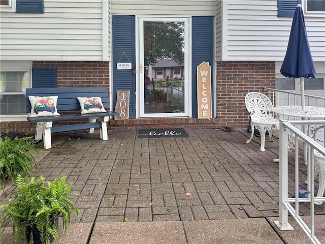 108 Bucks Rd, Cranberry Twp, PA 16066 - doorway to property featuring brick siding and a patio