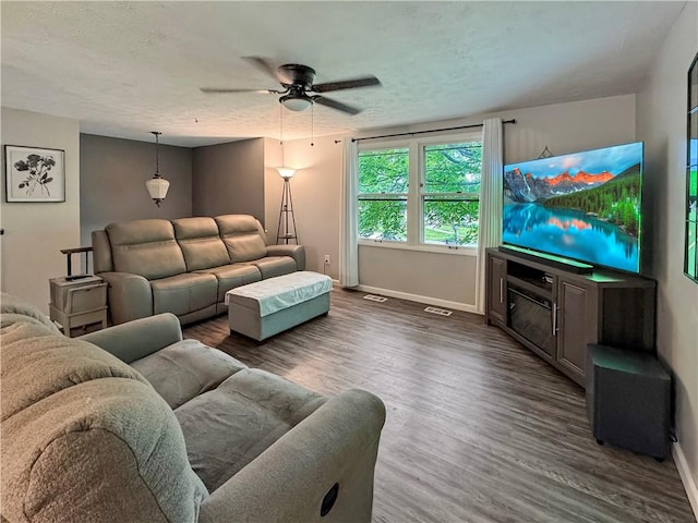 108 Bucks Rd, Cranberry Twp, PA 16066 - living room with baseboards, ceiling fan, wood finished floors, and a textured ceiling