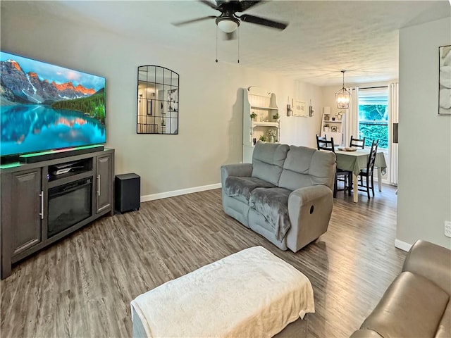 108 Bucks Rd, Cranberry Twp, PA 16066 - living room featuring baseboards, wood finished floors, ceiling fan, and a textured ceiling