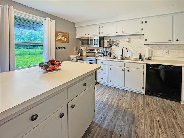 108 Bucks Rd, Cranberry Twp, PA 16066 - kitchen featuring stainless steel appliances, a sink, light countertops, tasteful backsplash, and white cabinetry