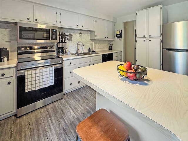 108 Bucks Rd, Cranberry Twp, PA 16066 - kitchen with appliances with stainless steel finishes, a sink, white cabinetry, and light countertops