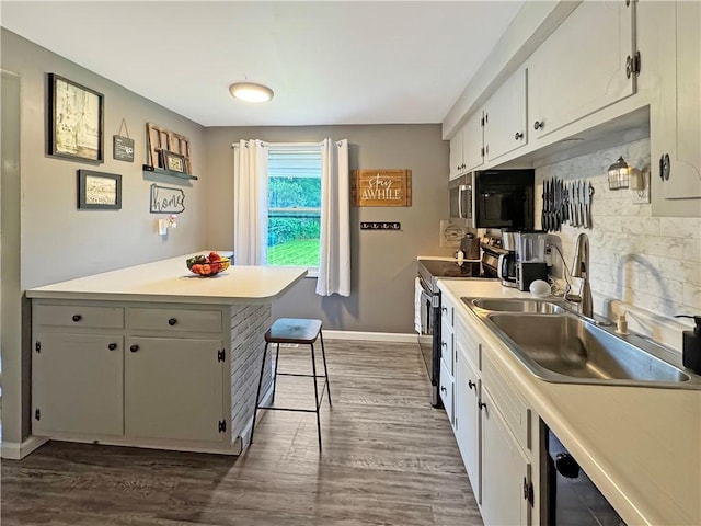 108 Bucks Rd, Cranberry Twp, PA 16066 - kitchen featuring electric stove, a sink, white cabinetry, and dark wood-style floors