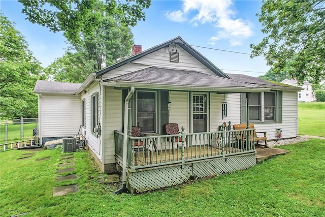 283 S 5th St, Sharpsville, PA 16150 - view of front facade featuring a chimney, central AC unit, a shingled roof, and covered porch