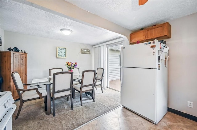 283 S 5th St, Sharpsville, PA 16150 - dining room with a textured ceiling, light tile patterned floors, and baseboards