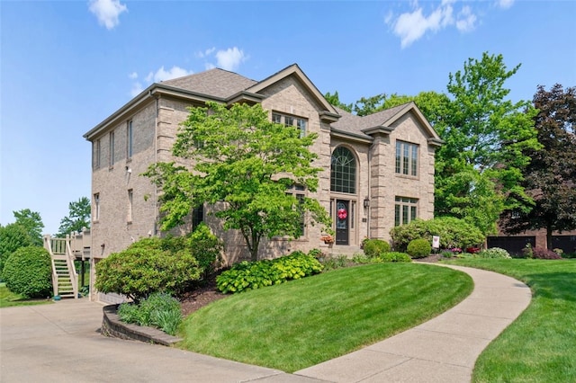 112 Beaver Creek Ct, Sewickley, PA 15143 - traditional-style house featuring a front yard, brick siding, and stairway