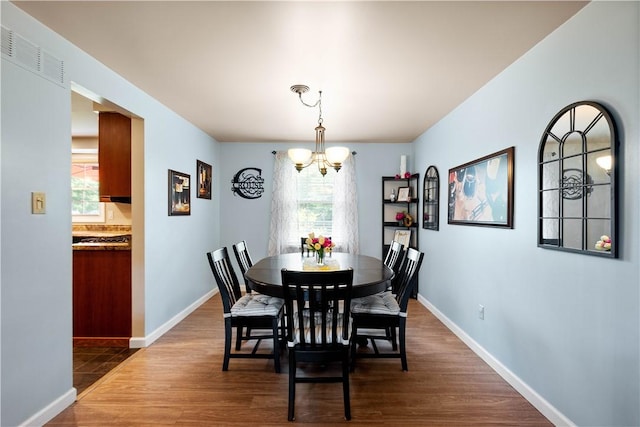 2609 Fox Chase Ct, South Fayette, PA 15017 - dining space with a chandelier, dark wood-style floors, and baseboards