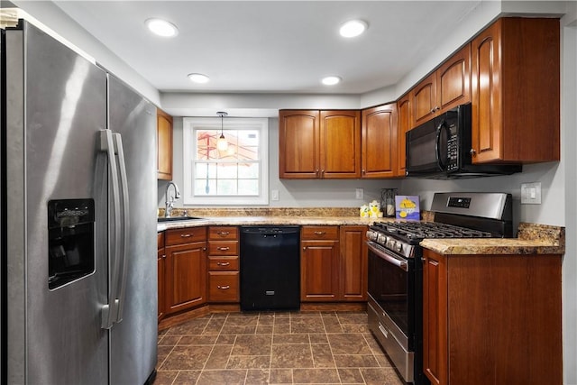 2609 Fox Chase Ct, South Fayette, PA 15017 - kitchen with black appliances, brown cabinets, a sink, hanging light fixtures, and stone finish flooring