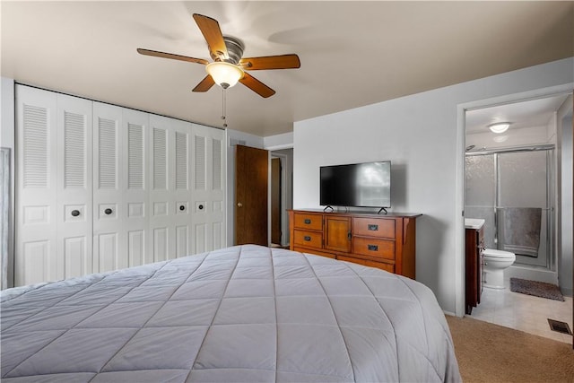 2609 Fox Chase Ct, South Fayette, PA 15017 - carpeted bedroom featuring ensuite bath, a closet, a ceiling fan, and tile patterned flooring