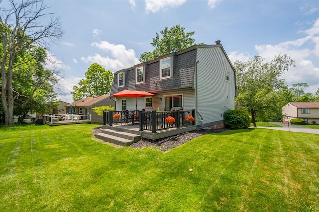 2609 Fox Chase Ct, South Fayette, PA 15017 - back of house with a wooden deck, a yard, a gambrel roof, and a shingled roof