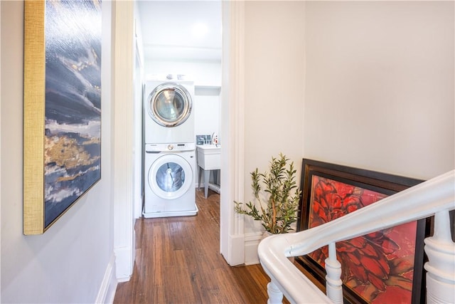 1701 Meadville St, Fineview, PA 15214 - washroom with stacked washer / dryer, wood finished floors, and baseboards